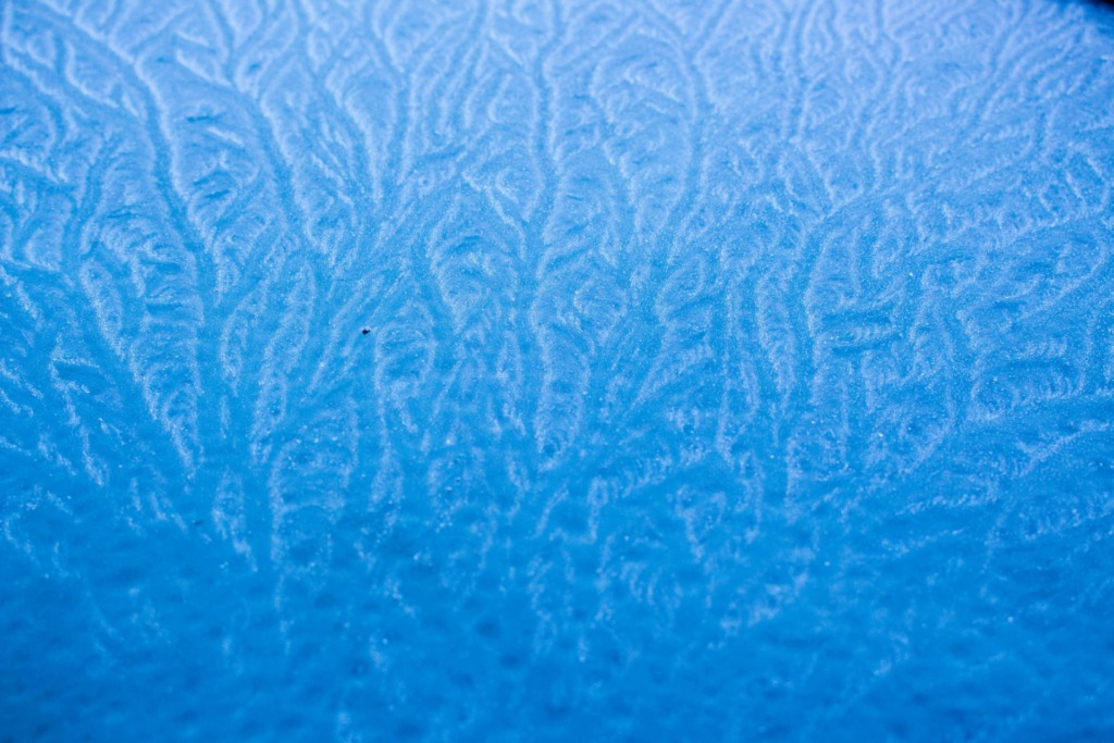 pexels-photo-33966640-33966640 Capture of intricate frost patterns on a blue frozen surface, ideal for abstract backgrounds.